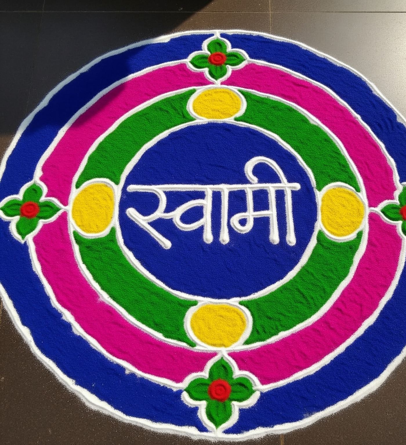 Detailed hand-drawn rangoli outline in progress