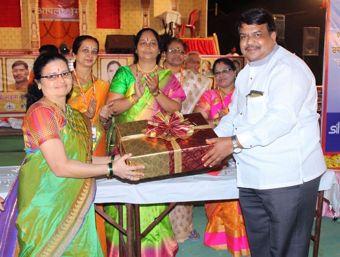 Wrapped gift box being handed over at an event